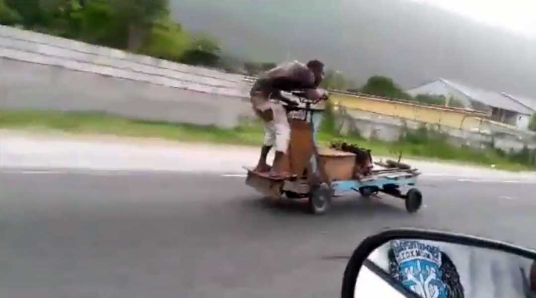 gas powered cart with engine on road highway Jamaica funny vide