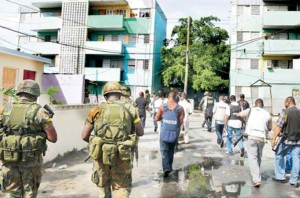 Media personnel and security forces tour Tivoli Gardens - 2010 - Source: jamaicaobserver.com
