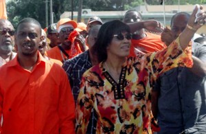 Prime Minister Portia Simpson Miller and People's National Party candidate Dwayne Vaz - Source: jamaica-gleaner.com