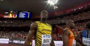 Bolt after comfortably winning heat in 9.96 seconds - Image via Youtube