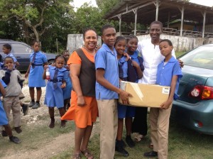 Students and a teacher at Water Valley Primary gather to say thanks to United Districts of Islington Representative Mrs. Lorna Mckenzie.