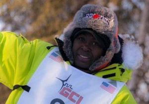 "Jamaican musher Newton Marshall (8530551972)" by Frank Kovalchek from USA - Jamaican musher Newton Marshall. Licensed under CC BY 2.0 via Commons.