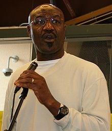 "Delroy Lindo cropped" by Mike Wooldridge - Delroy Lindo at Spelling Bee. Licensed under CC BY-SA 2.0 via Commons.