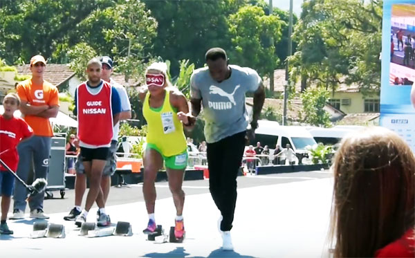 Brazilian Paralympian Terezinha Guilhermina runs with Usain Bolt via Youtube