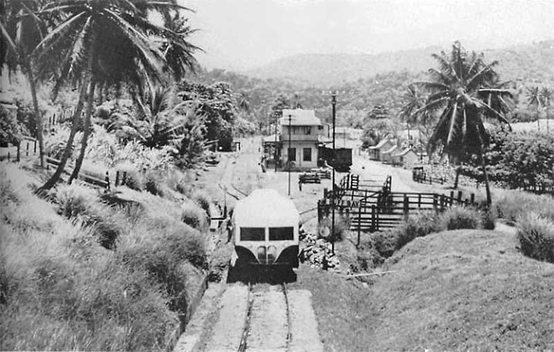 Jamaican railroad with railcar and station cairca May 1960